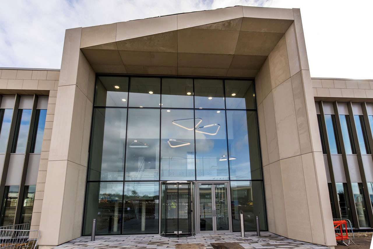 Girl sitting in her tent with a coffee
