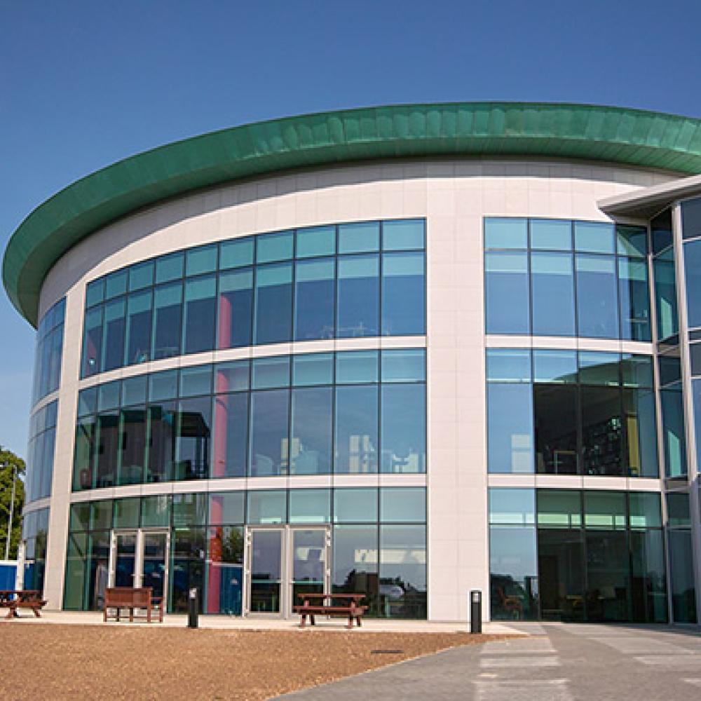 Girl sitting in her tent with a coffee