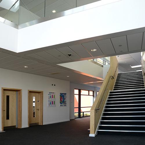 Girl sitting in her tent with a coffee